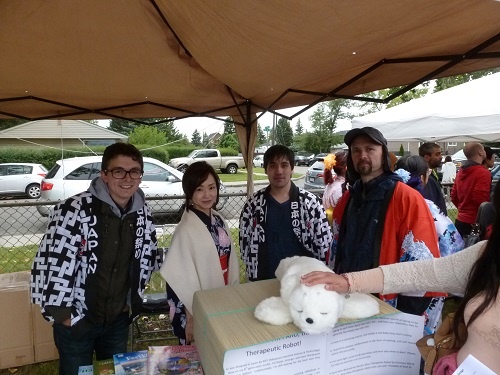Paro the Therapeutic Robot greets festival-goers at the Consulate-General of Japan Booth